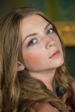 Blonde In Pink And White Dress Artfully Poses In Front O XXX Dessert