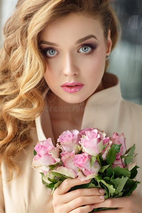 Portrait Of A Beautiful Delicate Sensual Blonde Girl With Roses