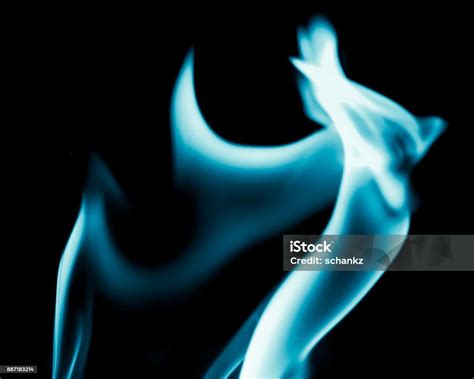 Abstract Background Of Blue Flame Fire On Black Background Stock Photo