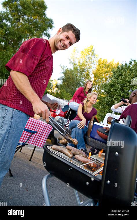 Series With College Football Fans Tailgating And Having Fun Before The