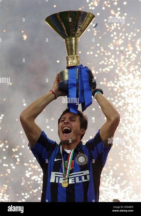 Inter's captain Javier Zanetti, of Argentina, holds up the trophy after ...