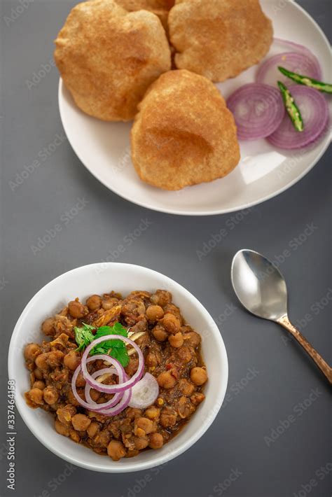 Fried Puri and Chole ki sabzi - famous indian food Stock Photo | Adobe ...