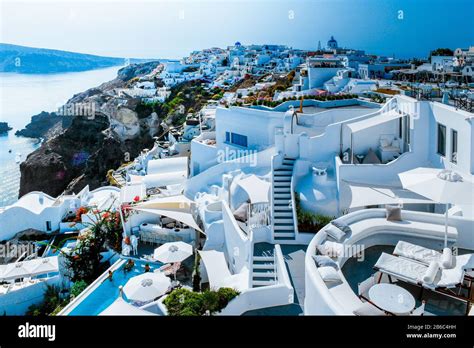 Santorini Oia village during sunset whit luxury hotels and whitewashed ...