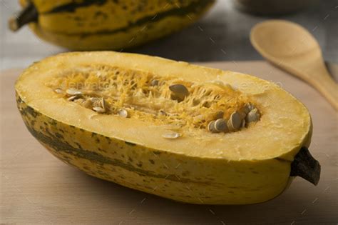 Halved raw spaghetti squash Stock Photo by picturepartners | PhotoDune