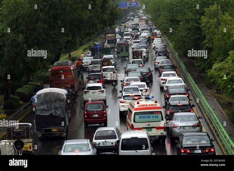 A Large Numbers Of Vehicles Stuck In Traffic Jam During Heavy Downpour