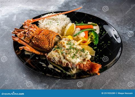 Lobster Thermidor with Rice Served in a Dish Isolated on Dark ...