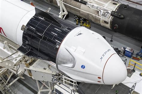 Crew Dragon and Falcon 9 in the hangar at Launch Complex 39A ahead of ...