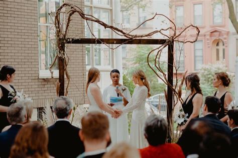 Same Sex Ceremony Under Simple Wood Canopy