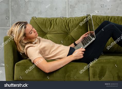 Blonde Woman Lying On Sofa Laptop Stock Photo 1829642723 Shutterstock