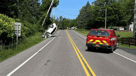 Car flipped over in single vehicle crash results in road closure, driver sent to hospital