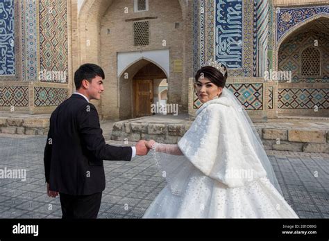 Bride And Groom In The City Centre Of Bukhara Uzbekistan Stock Photo