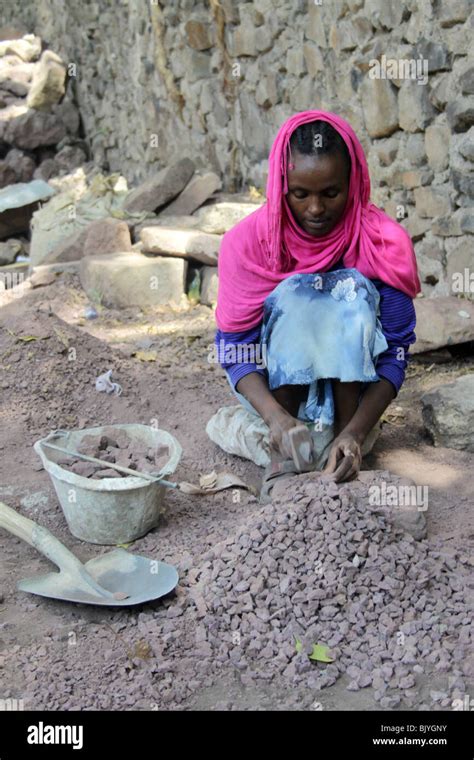 Africa Ethiopia Gondar Woman Crushes Stones With Hammer Stock Photo