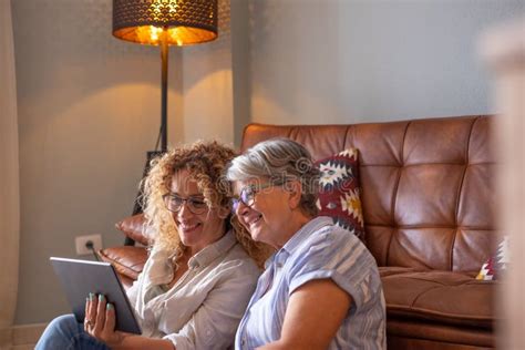 Happy Loving Older Mature Mother And Daughter Laughing Caring Smiling