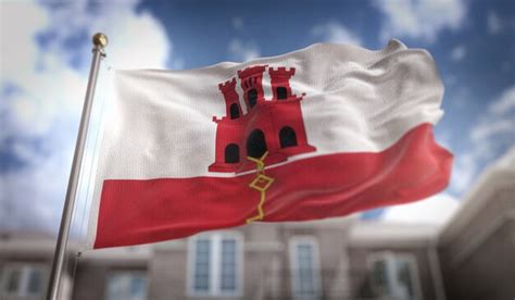 Premium Photo Gibraltar Flag D Rendering On Blue Sky Building Background