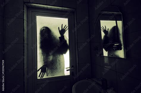 Horror woman in window wood hand hold cage scary scene halloween ...