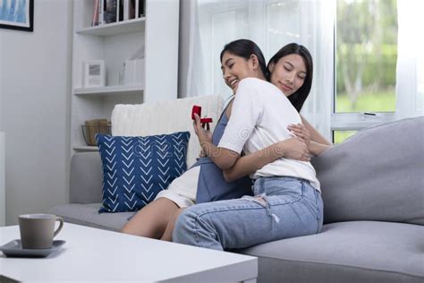 Engaged Women Couple Hugging Each Other Lovingly In Living Room Lgbt Lesbian Couple Love