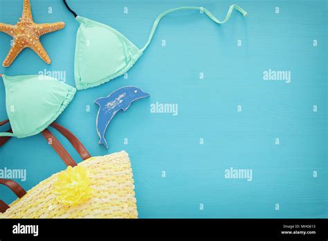 Vacation And Summer Image With Sea Life Style Objects And Mint Bikini Over Blue Wooden
