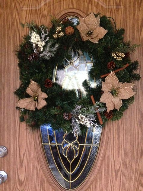 Christmas Wreath With Poinsettias And Pine Cones