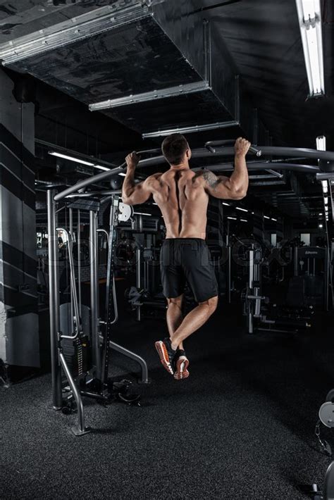 Back View Of Muscular Man Doing Pull Up Stock Image Colourbox