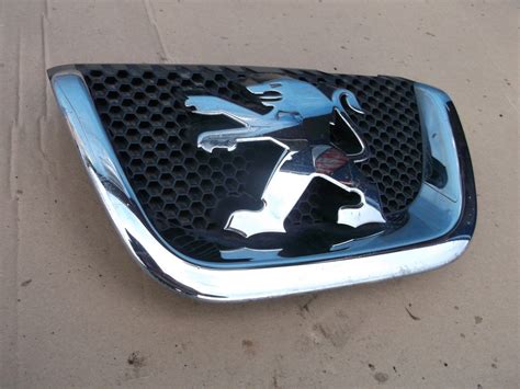 PEUGEOT 407 LOGO EMBLEMAT ZDERZAKA PRZEDNIEGO 7200548261 Oficjalne