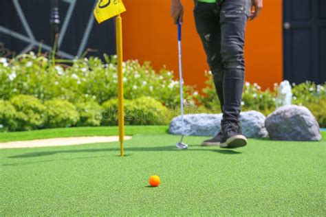 Close Up Of Miniature Golf Hole With Bat And Ball Stock Image Image