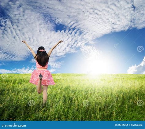 Happy Woman Jump In Green Grass Field Ans Bule Sky Stock Photo Image