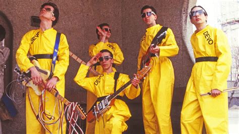 Devo Review: A Weirdly Normal Portrait of an Offbeat Band - POV Magazine