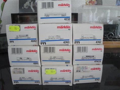 Märklin Lot de 9 wagons surbaissés avec camions et 1 voiture Kaufen