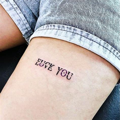 a woman's arm with the words i love you tattooed on her left side