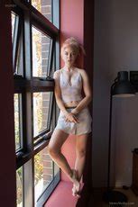 Stunning Blonde By The Window With Her Nice Tits Out Photos