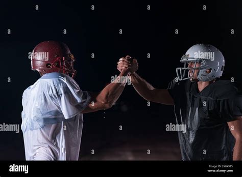 Two American Football Players Face To Face In Silhouette Shadow On