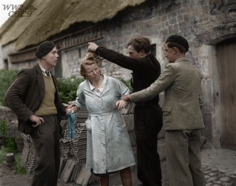 Two French men restrain a woman while another cuts her hair after she