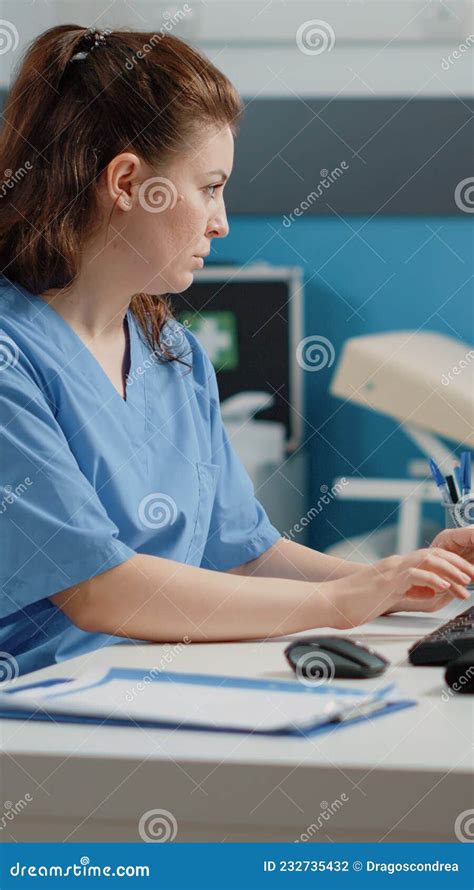 Nurse Typing On Computer Keyboard For Consultation Stock Photo Image