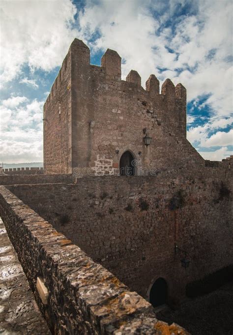 Medieval Stone Castle Tower With Dramatic Blue Sky And Clouds Stock