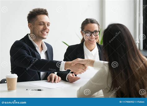 Smiling Hr Manager Handshaking Hired Female Applicant At Job Int Stock