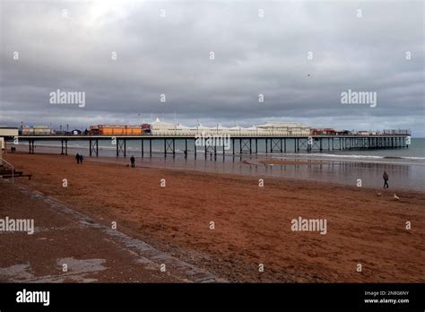 Paignton beach and Paignton pier and promenade at low tide. Taken January 2023 Stock Photo - Alamy