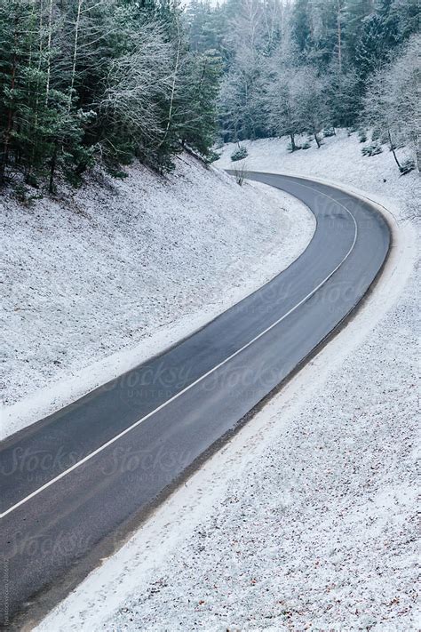 "Winter Road On Nature With Snow" by Stocksy Contributor "Ilya" - Stocksy