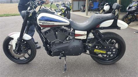 two motorcycles parked next to each other in front of a building