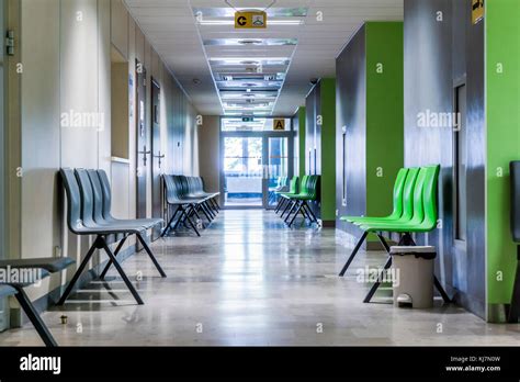 Corridor With Chairs For Patients In A Modern Hospital Stock Photo