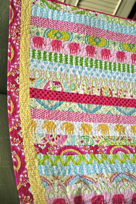 Strip Quilt Made With A Variety Of Fabrics Including Kumari Garden