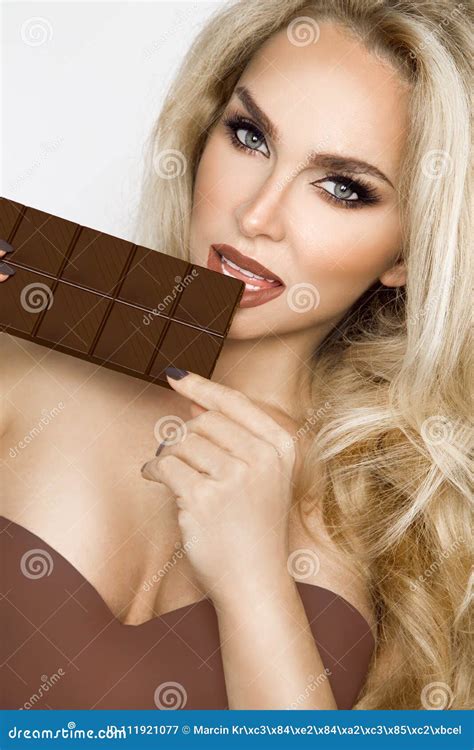Beautiful Blonde Women With Green Eyes Sensually Eating Tasty Chocolate Stock Image Image Of