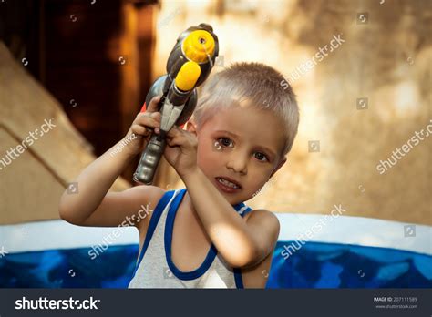 205 Boy Play Watergun Images, Stock Photos & Vectors | Shutterstock