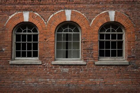 Vintage Brick Building With Arched Windows Premium Ai Generated Image