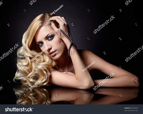 Glamour Portrait Of Beautiful Curly Blonde Girl And Her Reflection In