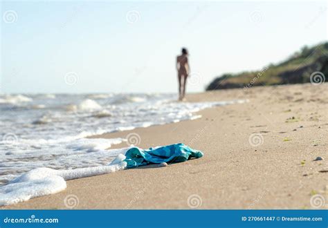 Swimsuit In The Sand On The Beach And Naked Female Figure Stock Image