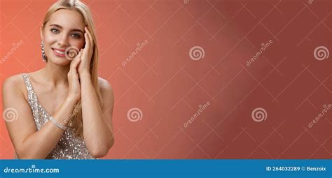 Tender Feminine Gentle Blond Woman In Silver Stylish Dress Touching Face Lovely Smiling Camera