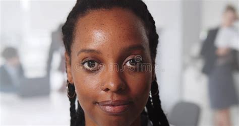 Close Up Portrait Of Smiling Black Young Woman Looking At Camera