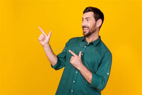 Photo Of Optimistic Man With Brunet Hair Dressed Dotted Shirt Look Directing At Sale Empty Space