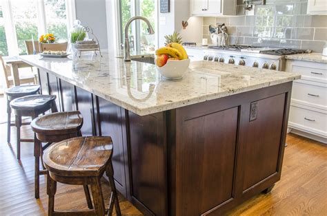 Kitchen With White Cabinets And A Dark Cherry Island With Wood