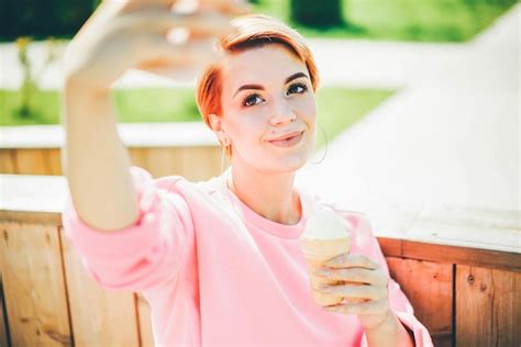 Premium Photo Portrait Of Smiling Young Woman Using Mobile Phone